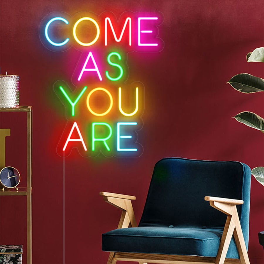 Multicolored neon sign reading come as you are