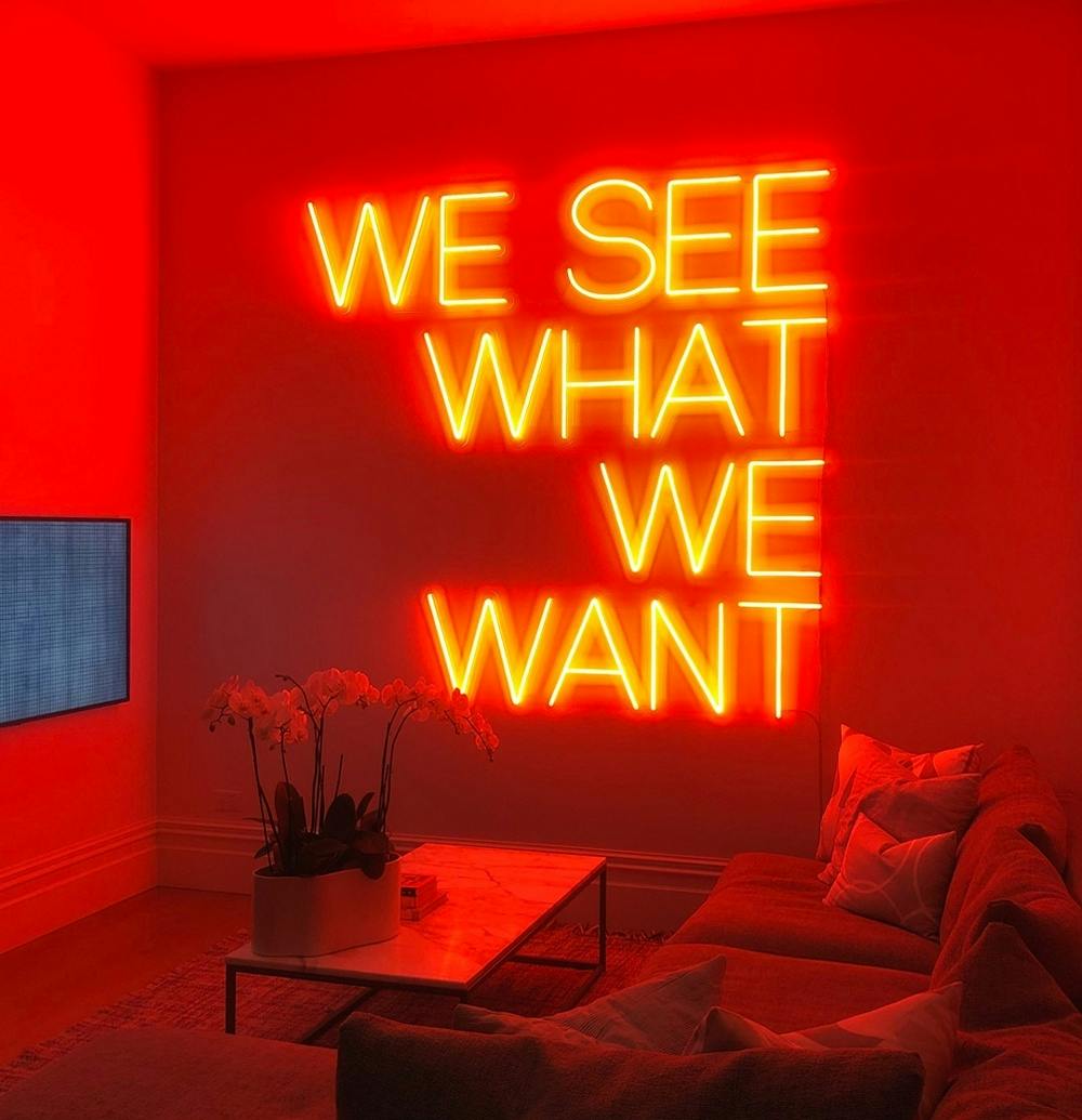 Neon sign on wall in lounge